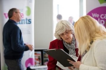 Healthwatch staff member speaking to a member of the public about their experience